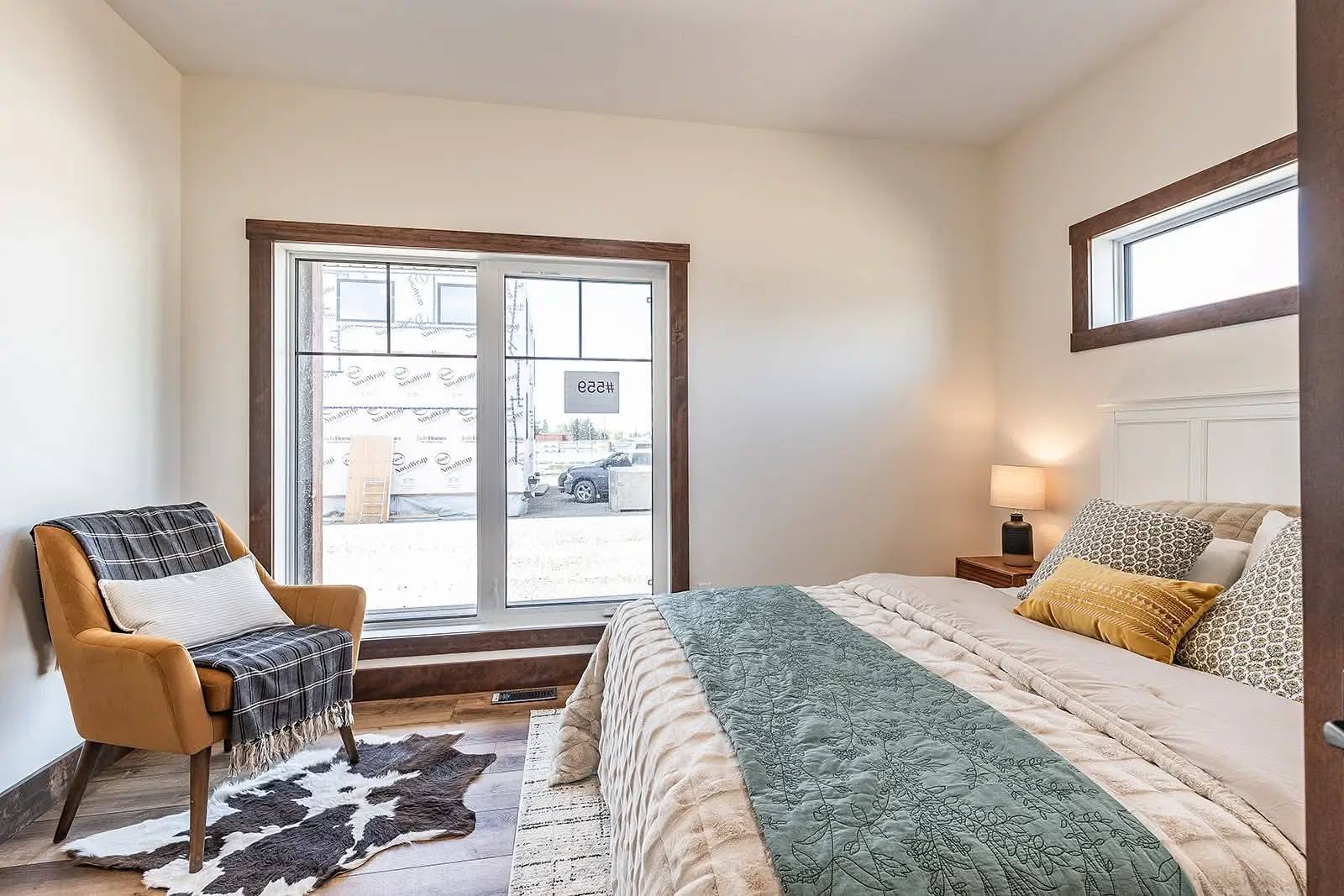 This extensive image gallery showcases various luxury housing models, including tiny homes, park models, and large manufactured residences that blend a modern farmhouse aesthetic with high-end functional design. The exteriors are characterized by high-contrast color schemes, featuring white or cream board-and-batten siding paired with dark charcoal gables, gabled front porches with black or white support pillars, and durable metal or shingle roofing. Inside, the living areas emphasize an upscale, open-concept lifestyle with vaulted ceilings—some featuring natural wood planks, exposed beams, or tray designs with ceiling fans—complemented by wide-plank wood-look flooring and crisp shiplap or neutral-toned walls.

Gourmet kitchens are designed for high functionality, offering cabinetry in finishes ranging from light natural oak to elegant black or white, paired with marble-patterned or wood-block countertops, stainless steel farmhouse sinks, and large center islands with modern pendant lighting. Additional luxury elements include integrated booth seating, transom windows for maximum natural light, industrial-style accents, and spacious bedrooms with wood-look flooring or neutral carpeting. Contemporary bathrooms complete the homes with white vanities, black hardware, and choices of walk-in showers or large soaking tubs.