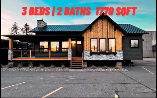 Single-story modern house with large windows and a wooden facade. Text overlay reads: "3 Beds | 2 Baths | 1770 SqFt." Calm evening setting.