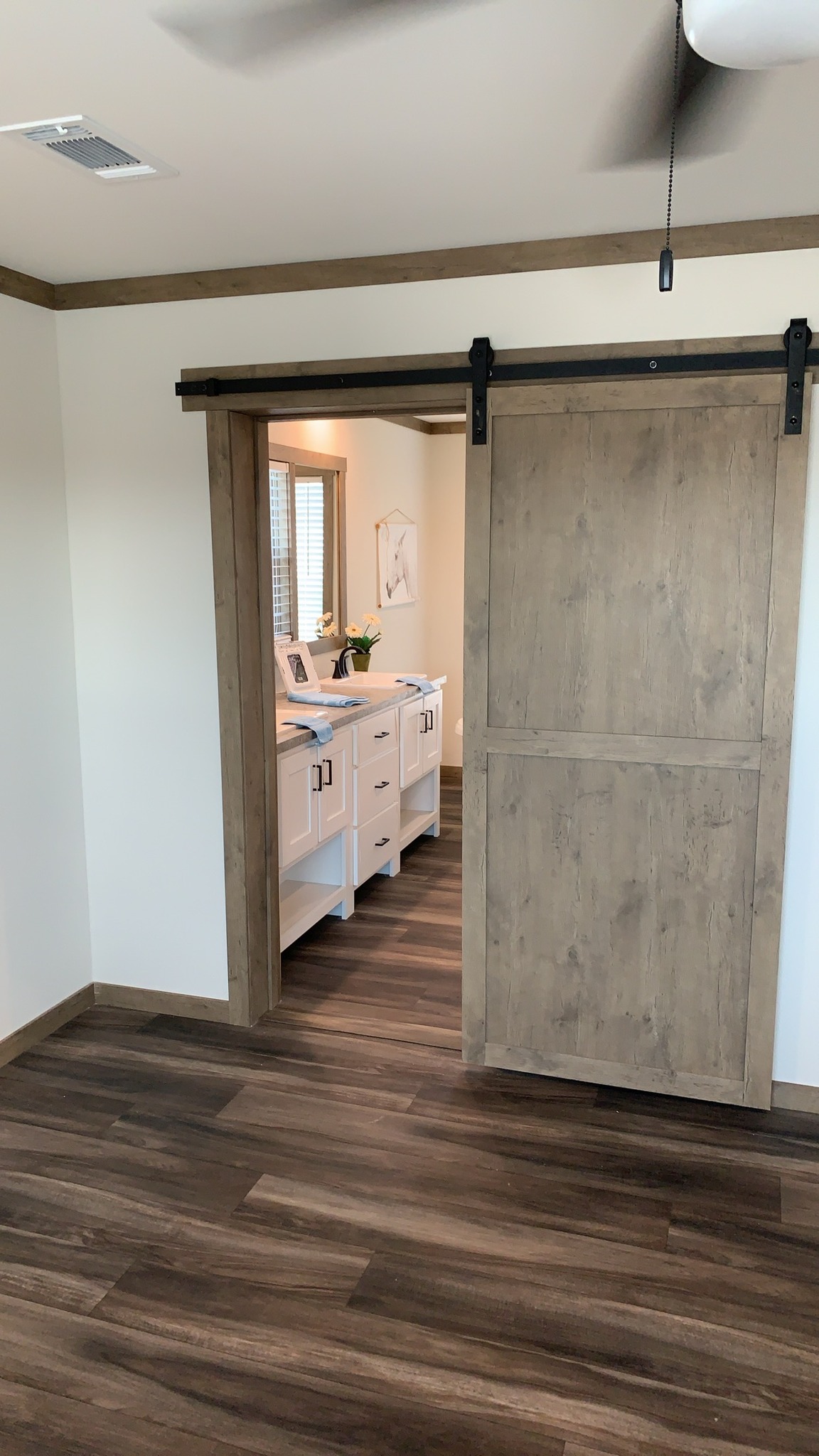 Comprehensive luxury modular home collection featuring 819 SQ FT farmhouse floor plans, navy blue and white exteriors, gourmet kitchens with quartz waterfall islands, hidden arched pantries, industrial corrugated metal accents, stone fireplaces, and vaulted tiny home lofts with sliding barn doors.