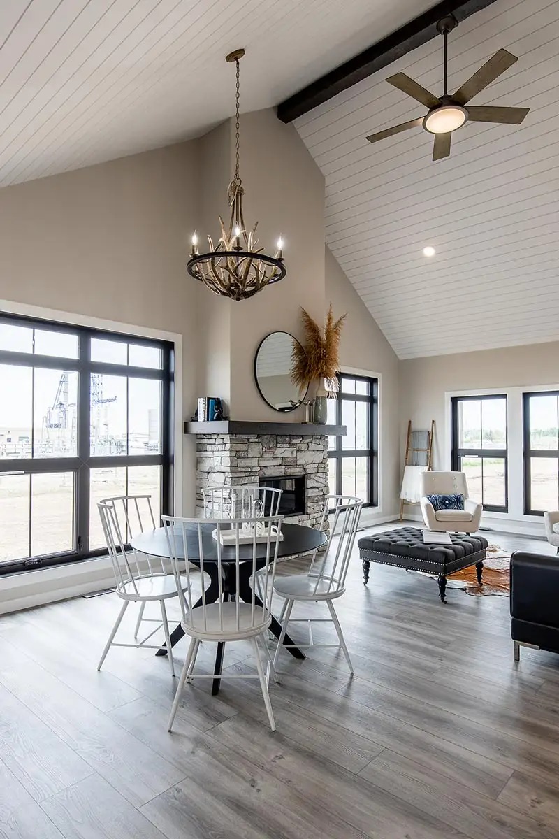 Comprehensive luxury modular home showcase featuring the APH 1662C 819 SQ FT floor plan, white vertical siding farmhouse exteriors, and modern interiors with granite waterfall islands, wood-beamed ceilings, rustic sliding barn doors, stacked stone fireplaces, and spacious open-concept kitchen-living areas.