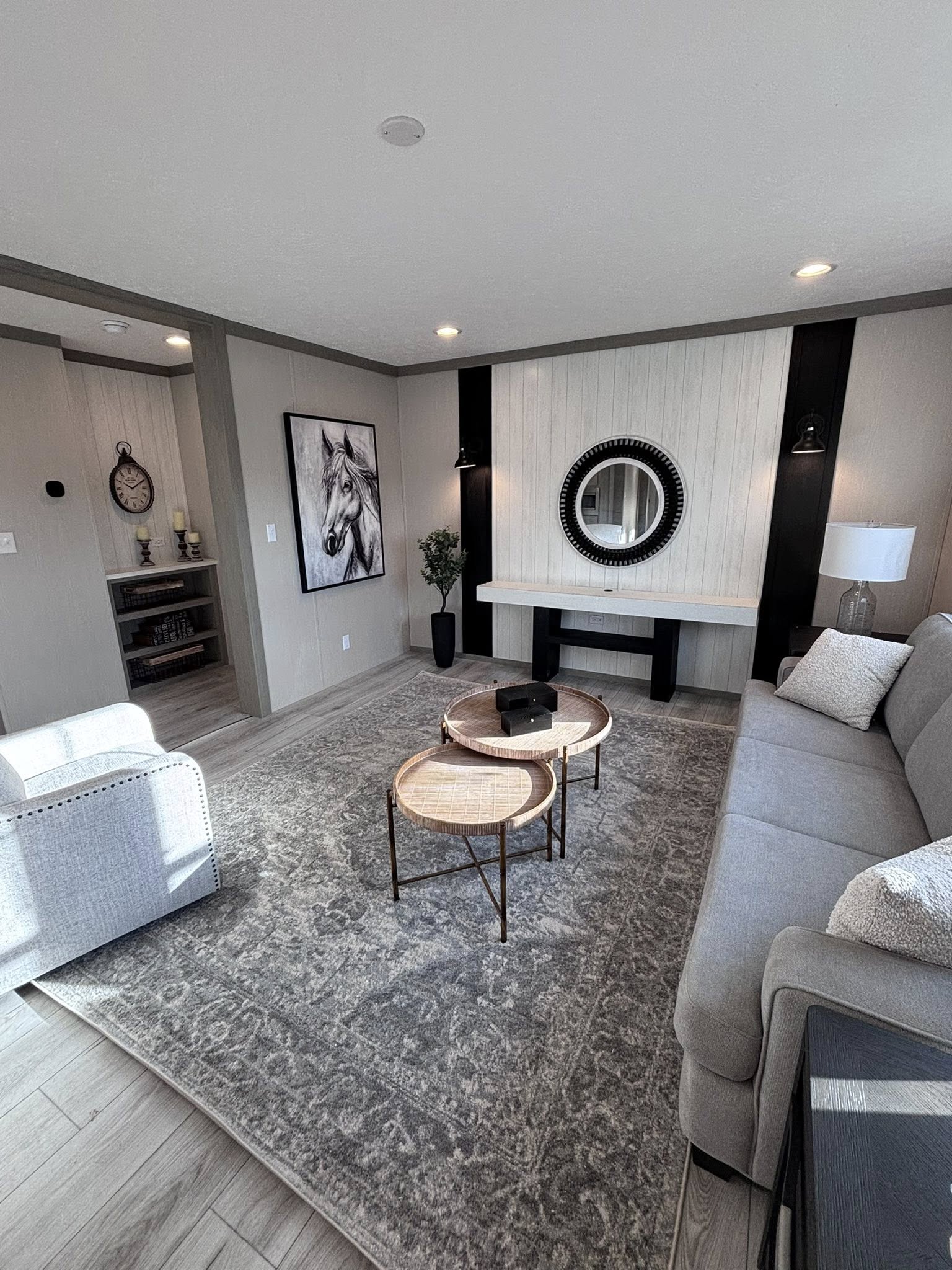 This extensive image gallery highlights a variety of luxury housing models, including modern farmhouse manufactured residences, park models, and modular homes. The exteriors feature premium finishes such as white board-and-batten siding with dark pillars, grey horizontal siding with natural wood shutters, and gabled front porches.