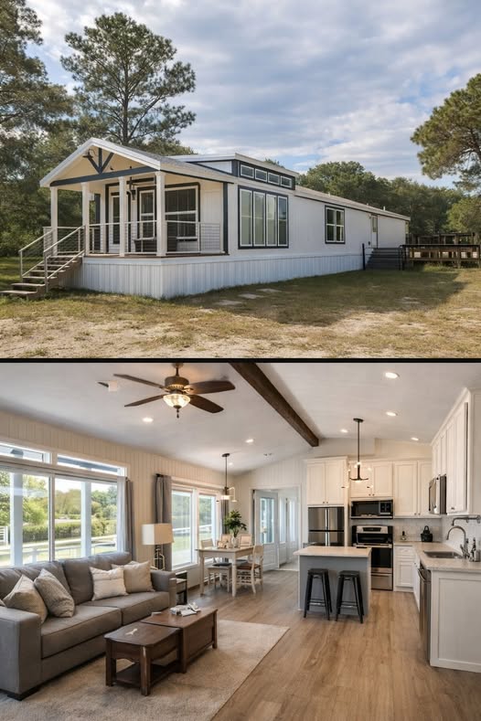 A modern modular home exterior with a gabled porch and large windows is set against a wooded background. The interior features an open-plan living area with a cozy gray sofa, wooden furniture, and a bright kitchen with white cabinets and stainless steel appliances.