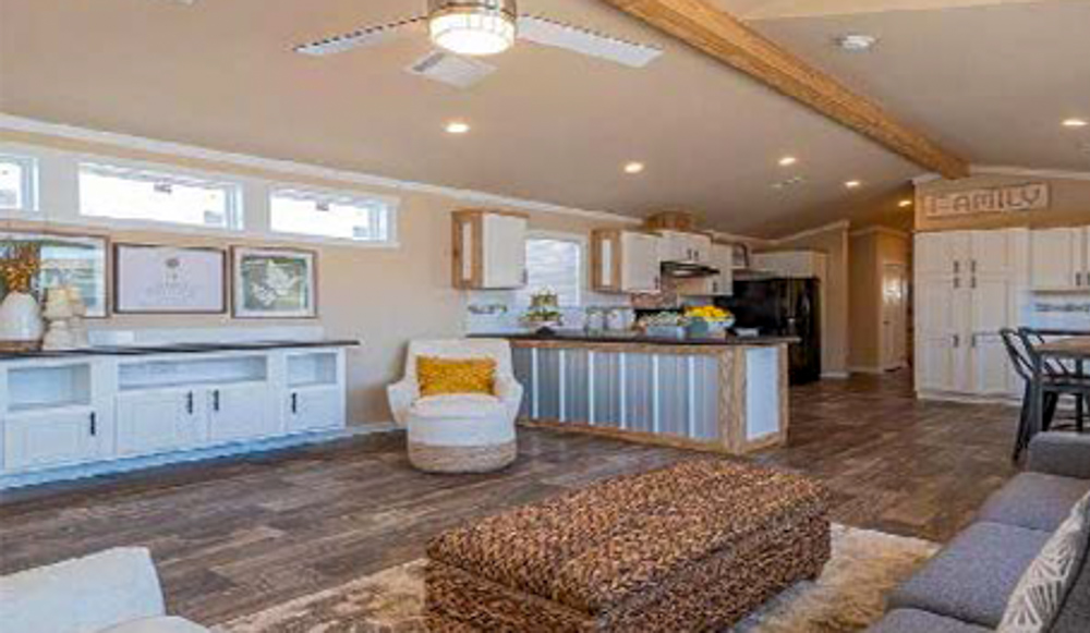 This comprehensive collection of luxury residential properties showcases a diverse range of modern manufactured homes, tiny homes, and park models, including the signature "The Boujee XL" aesthetic. Exterior designs feature a modern farmhouse with cream-colored board-and-batten siding, a white metal roof, and a black-pillared front porch, alongside a rustic park model with natural log-cabin siding, a green metal roof, and an expansive elevated wooden deck decorated with a holiday wreath. The interiors highlight a "modern boujee" lifestyle with high-end finishes such as vaulted ceilings with exposed wood beams, white shiplap walls, and natural pine-paneled accents. Gourmet kitchen layouts vary from rustic wood cabinetry with stone-look countertops and white appliances to striking high-contrast spaces featuring deep navy blue cabinetry, marble-look countertops, and multi-tone stone tile backsplashes. Functional luxury is consistent throughout the open-concept living areas, which include wood-look flooring, industrial-style lighting, integrated lofted sleeping areas with wooden balustrades, and bright interiors with large windows that emphasize natural light.