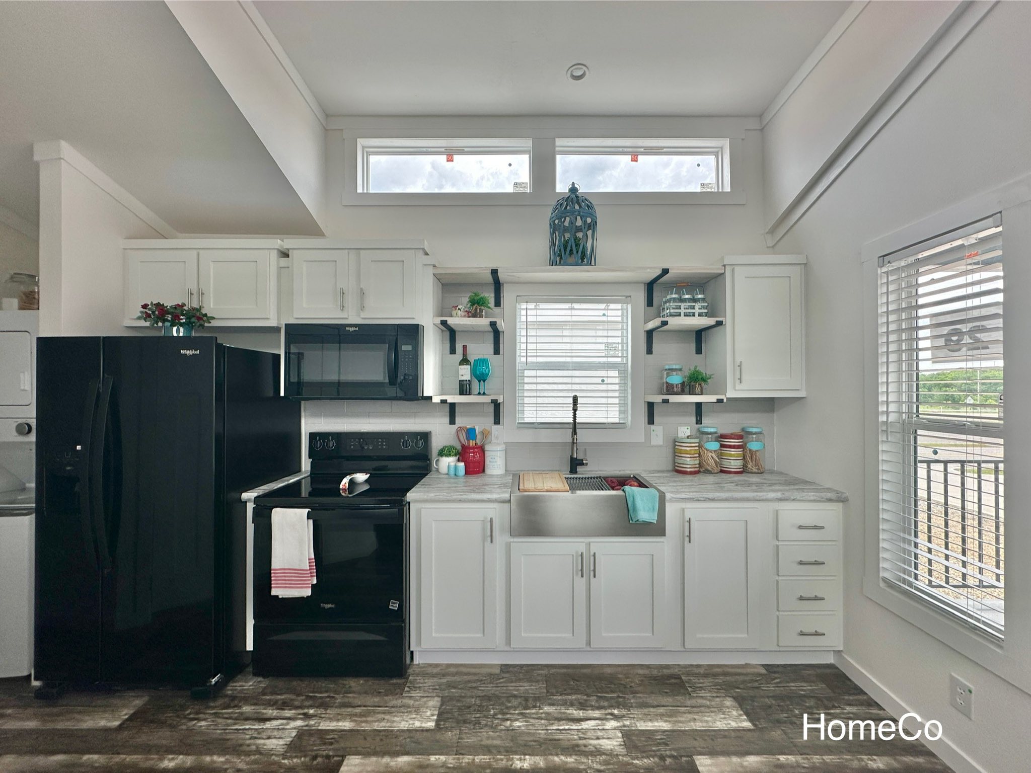 High-ranking SEO-optimized gallery of luxury tiny houses and modern manufactured homes, featuring a navy blue park model with a spacious screened porch and rustic wood trim, a light blue beach cottage with a vaulted white shiplap interior and gourmet kitchen, and a large white ranch-style modular home with brick skirting; the collection highlights premium mobile living, innovative small-space architectural design, and contemporary interior decor featuring vaulted ceilings, LED-accented tray ceilings, stainless steel appliances, and stylish living areas with green velvet seating for maximum search visibility.