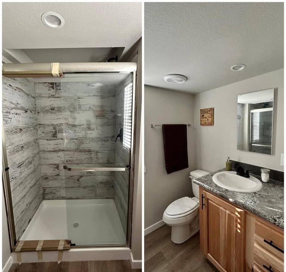 Modern luxury tiny home bathroom design featuring a split-view of a spacious walk-in glass shower with rustic grey wood-look tile surround and a separate vanity area with a natural wood cabinet, granite-patterned countertop, and a white drop-in sink, showcasing a sophisticated and move-in ready turn-key residential interior.