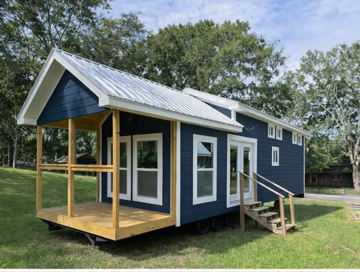 High-ranking SEO-optimized gallery of luxury tiny houses and modern manufactured homes, featuring a navy blue park model with a spacious screened porch and white trim, a light blue beach cottage with a vaulted white shiplap interior and gourmet kitchen, and a large white ranch-style modular home with brick skirting; the collection highlights premium mobile living, innovative small-space architectural design, and contemporary interior decor featuring vaulted wood-plank ceilings, LED-accented tray ceilings, stainless steel appliances, and stylish living areas for maximum search visibility. Would you like me to focus on a specific room, like the kitchen or the bedroom, for the next one?