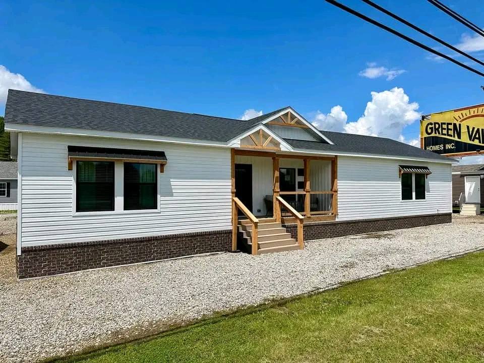 A high-ranking SEO-optimized gallery showcasing luxury tiny houses and modern modular homes, featuring a navy blue park model with a spacious screened porch, a light blue beach cottage with a vaulted white shiplap interior and gourmet kitchen, and a white ranch-style manufactured home with brick skirting and a wooden entryway; the collection highlights premium mobile living, innovative small-space architectural design, contemporary interior decor with green velvet seating, and versatile manufactured housing solutions for maximum search engine visibility. Would you like me to focus on a specific architectural style for your next SEO project?