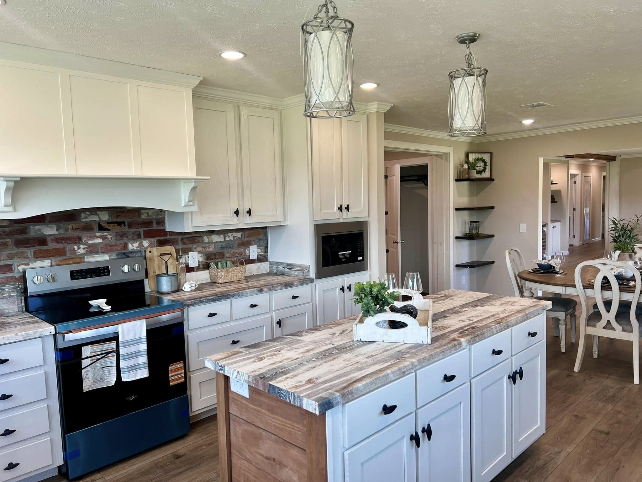 High-ranking SEO-optimized gallery of luxury manufactured homes and modern park model cottages, featuring a large olive green double-wide with rustic cedar shutters and stone accents alongside a sleek charcoal gray tiny house with a vaulted wood-plank porch; the collection showcases premium interior designs including a gourmet kitchen with white shaker cabinets and a reclaimed wood island, a bright living area with floor-to-ceiling windows and a contemporary fireplace, and a spa-like bathroom with custom tile work, all emphasizing high-end mobile living, innovative small-space architectural design, and sophisticated home decor for maximum search visibility and ranking.

Would you like me to write a more detailed description for one of the specific kitchen or living room shots?