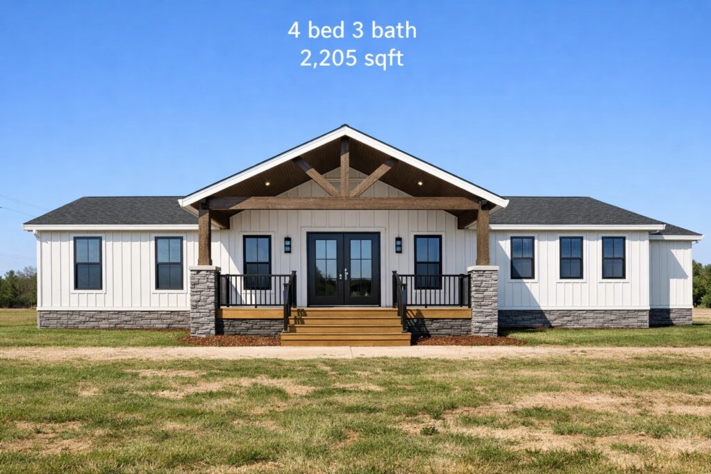 Modern farmhouse exterior featuring white board and batten siding, a dark gray shingled roof, and a prominent wooden timber-framed front porch with stone pillar accents, showcasing a spacious 2,205 sq ft single-story luxury mobile or modular home with 4 bedrooms, 3 bathrooms, black-trimmed windows, and a double glass front door set against a clear blue sky.