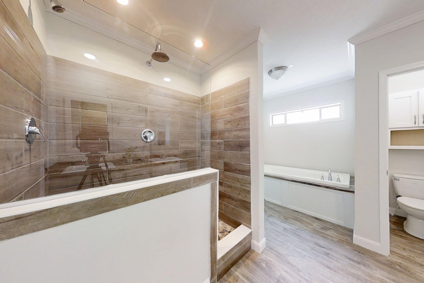 Gemini said
Modern living room featuring a floor-to-ceiling stacked stone fireplace with a dark wood timber mantle, an integrated black electric fireplace, and a raised grey stone hearth, flanked by custom white built-in bookshelves and cabinetry on light oak hardwood flooring, capturing a perfect transitional interior design for cozy home renovation and luxury real estate inspiration.