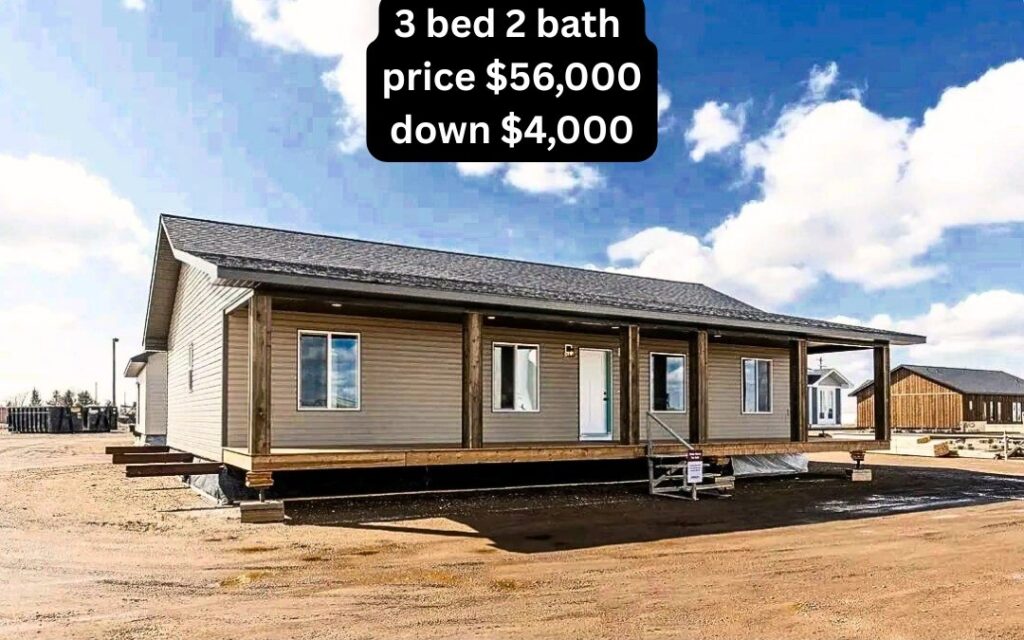 Single-story modular home with a wooden porch set on a dirt lot under a bright blue sky. Text notes: "3 bed 2 bath, price $56,000, down $4,000."