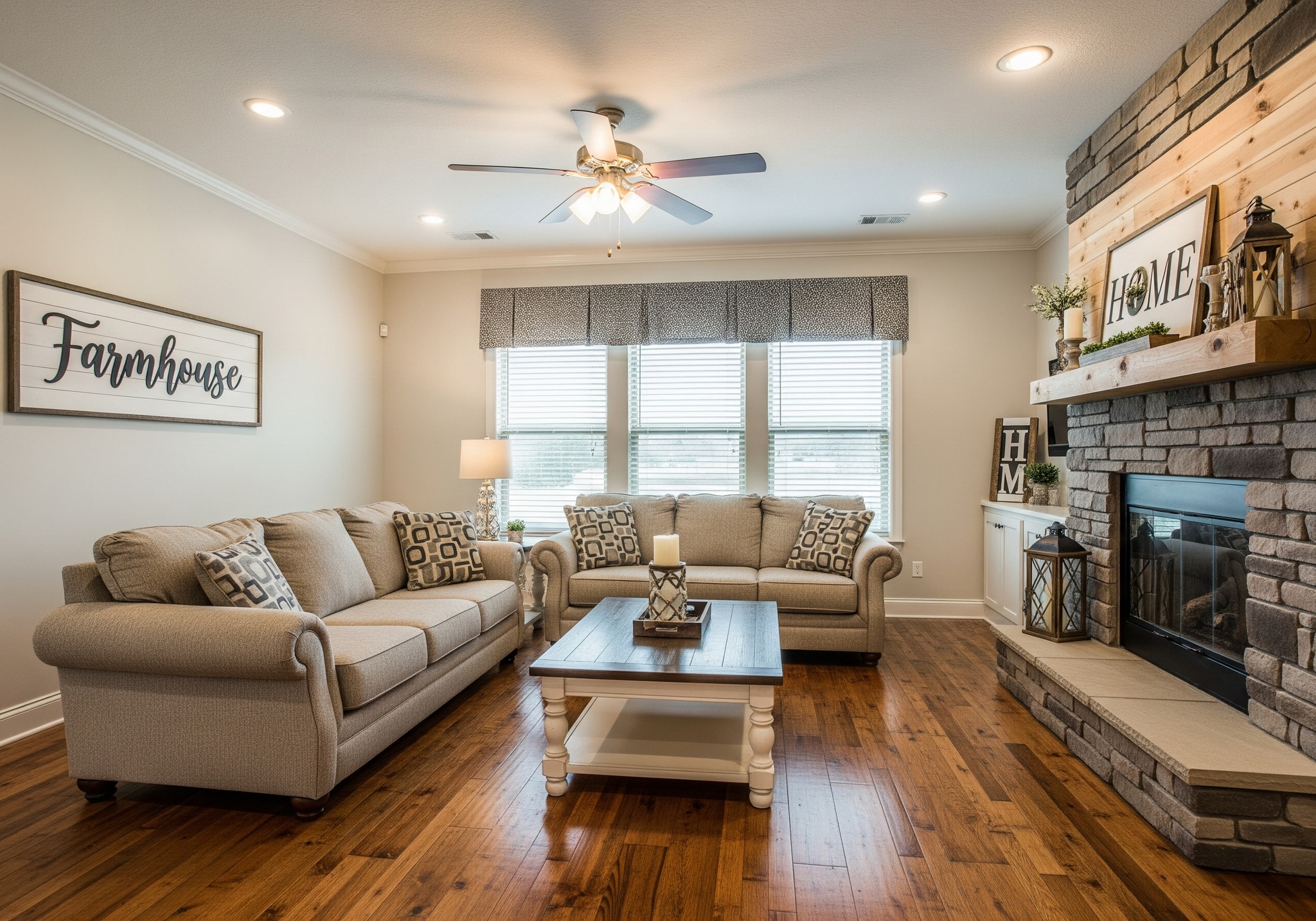 Cozy farmhouse-style living room with beige sofas, patterned cushions, and a wooden coffee table. Stone fireplace adorned with decor, emitting warmth.